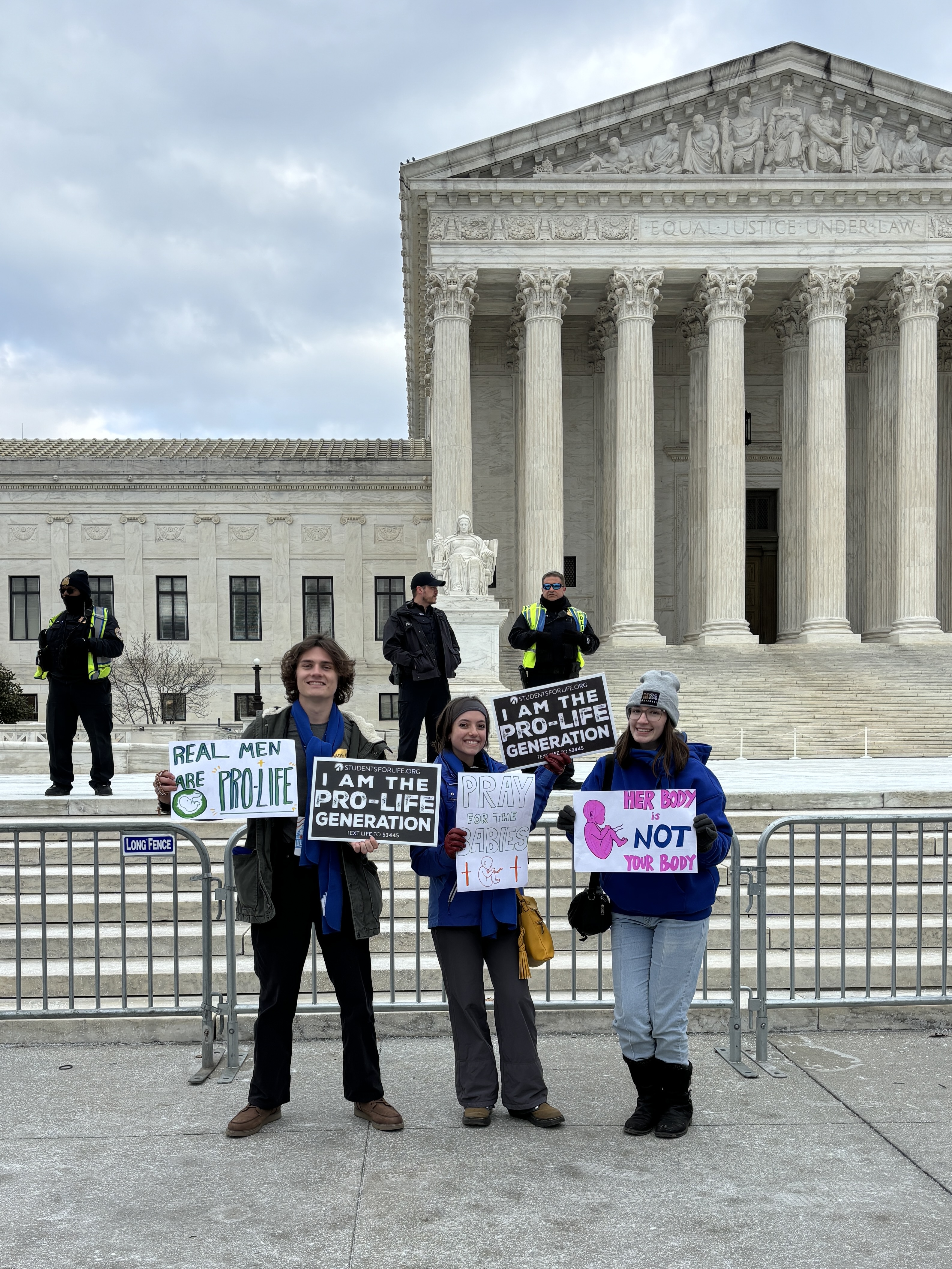 Dylan, Madison, and Abigail in front of the Supreme Court.  